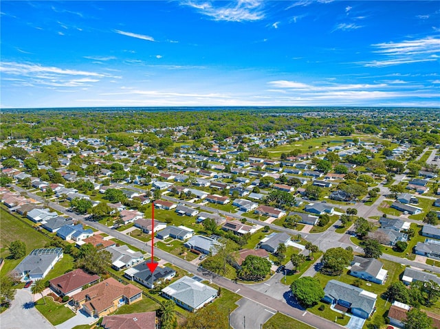 birds eye view of property with a residential view