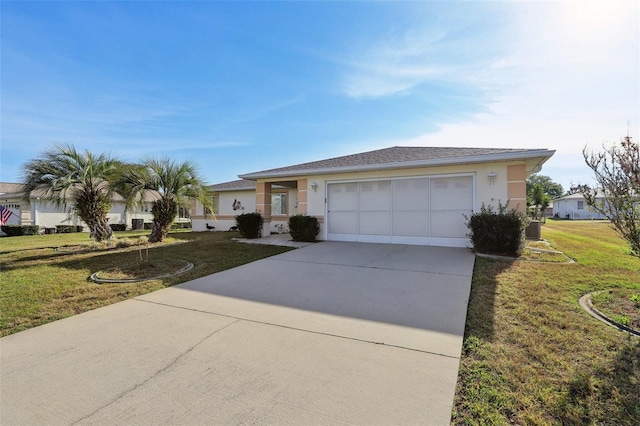 ranch-style home with driveway, an attached garage, a front yard, and stucco siding