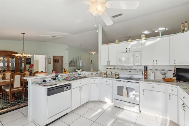kitchen with a sink, a peninsula, light tile patterned floors, white appliances, and visible vents