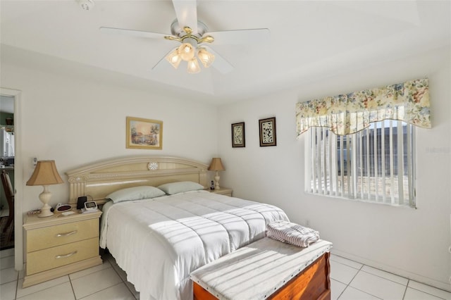 bedroom with ceiling fan and light tile patterned floors