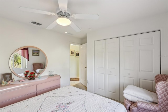 bedroom with visible vents, a closet, and a ceiling fan