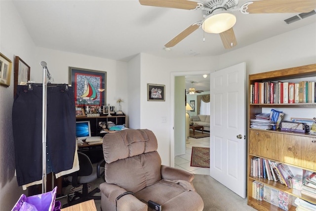 office area featuring tile patterned floors, visible vents, and ceiling fan