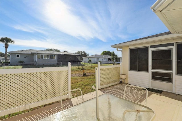 view of patio with outdoor dining area and fence