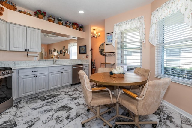 dining area with marble finish floor, ceiling fan with notable chandelier, baseboards, and recessed lighting