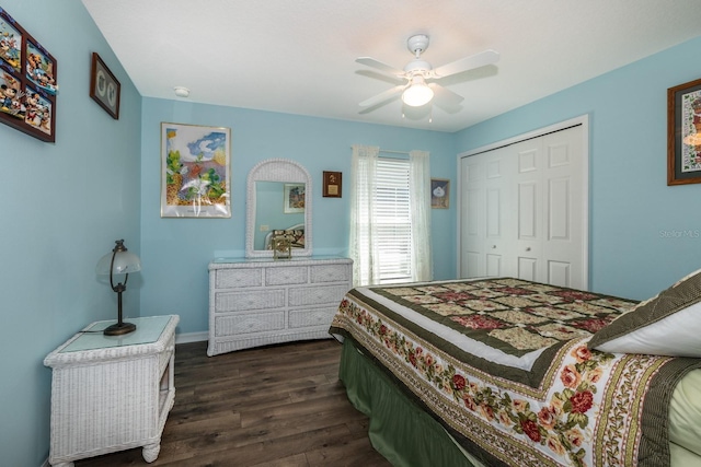 bedroom with a ceiling fan, dark wood-type flooring, and a closet