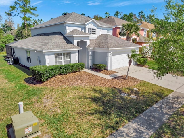 traditional-style home with stucco siding, driveway, a shingled roof, a front yard, and an attached garage