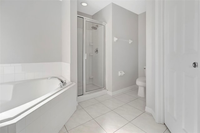 full bath with toilet, tile patterned floors, a bath, and a stall shower