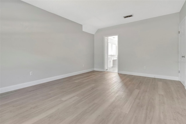 unfurnished room with visible vents, baseboards, and light wood-style floors