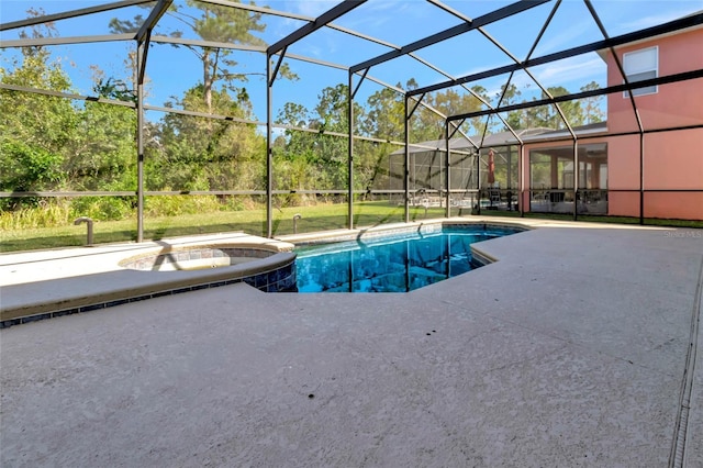 view of pool featuring a patio, a lanai, and a pool with connected hot tub