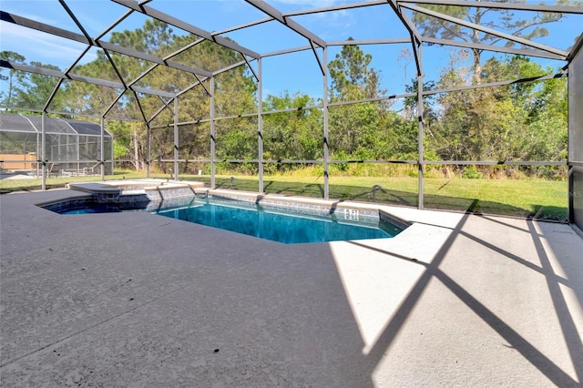 view of swimming pool featuring a patio, a lawn, a pool with connected hot tub, and a lanai