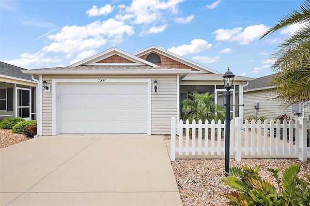 3557 Cochran St, The Villages, FL 32163 - view of front of house featuring fence, a garage, and driveway