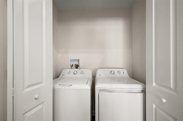 3557 Cochran St, The Villages, FL 32163 - clothes washing area with washer and dryer and laundry area