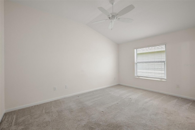 3557 Cochran St, The Villages, FL 32163 - spare room with baseboards, light colored carpet, vaulted ceiling, and a ceiling fan