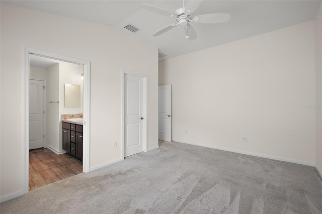 3557 Cochran St, The Villages, FL 32163 - unfurnished bedroom with visible vents, baseboards, a ceiling fan, connected bathroom, and carpet flooring