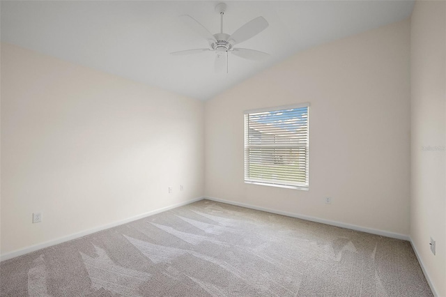 3557 Cochran St, The Villages, FL 32163 - unfurnished room featuring baseboards, vaulted ceiling, light colored carpet, and a ceiling fan