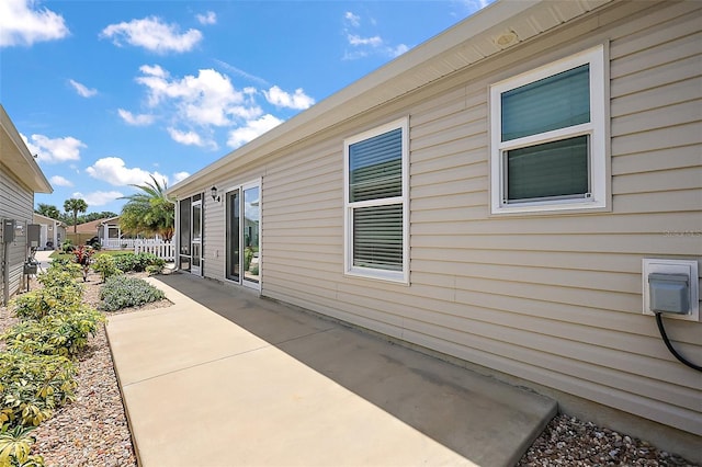 3557 Cochran St, The Villages, FL 32163 - view of home's exterior featuring a patio and fence