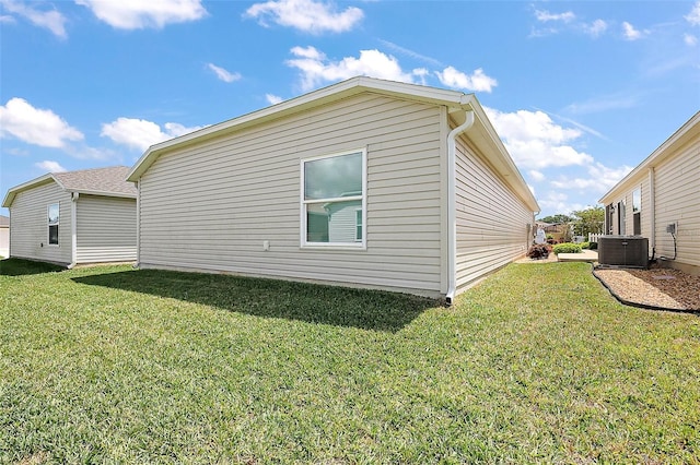 3557 Cochran St, The Villages, FL 32163 - view of home's exterior featuring a yard and central air condition unit