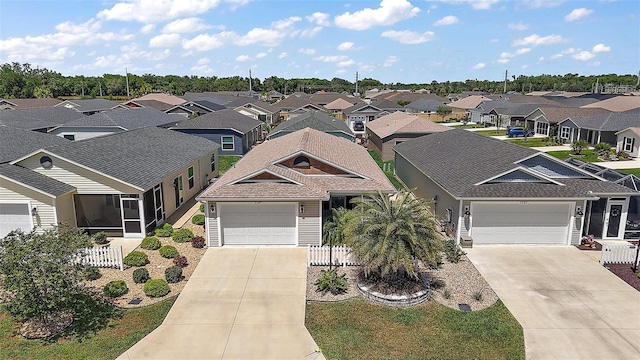 3557 Cochran St, The Villages, FL 32163 - view of front of house featuring fence, a shingled roof, a residential view, and concrete driveway