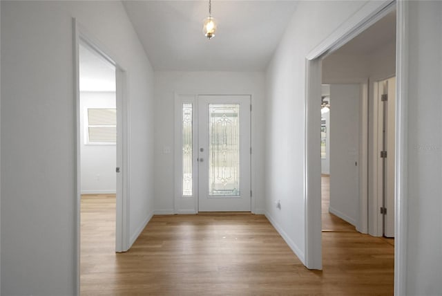 2433 Tamarindo Dr, The Villages, FL 32162 - entrance foyer with baseboards and light wood-style flooring