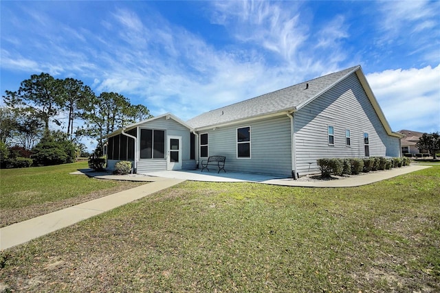 2433 Tamarindo Dr, The Villages, FL 32162 - back of property featuring a lawn, a sunroom, and a patio area