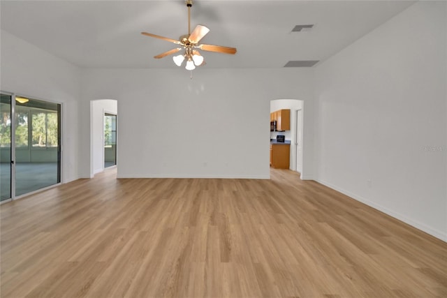 2433 Tamarindo Dr, The Villages, FL 32162 - unfurnished room featuring arched walkways, ceiling fan, visible vents, and light wood finished floors