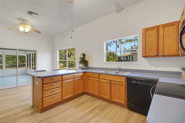 2433 Tamarindo Dr, The Villages, FL 32162 - kitchen featuring black dishwasher, a sink, visible vents, a ceiling fan, and a peninsula