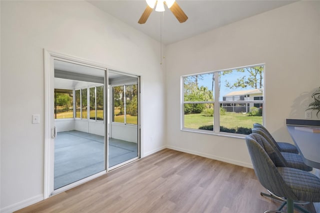 2433 Tamarindo Dr, The Villages, FL 32162 - unfurnished office featuring baseboards, wood finished floors, and ceiling fan