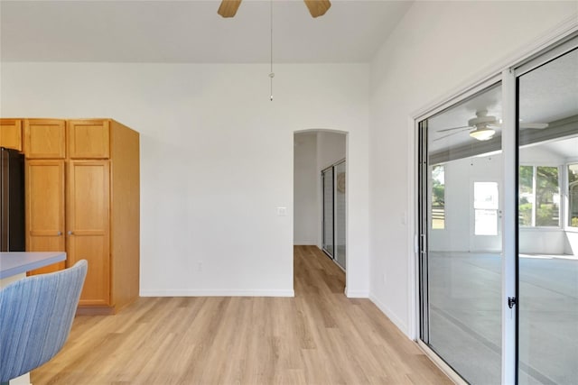 2433 Tamarindo Dr, The Villages, FL 32162 - interior space with arched walkways, light wood-style floors, and a ceiling fan