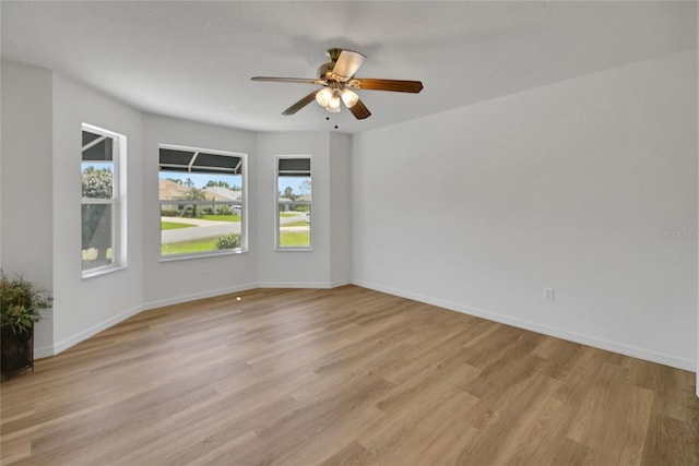 2433 Tamarindo Dr, The Villages, FL 32162 - unfurnished room with light wood-style flooring, baseboards, and ceiling fan