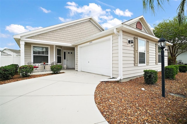 1093 Peninsula St, The Villages, FL 32162 - view of front of home featuring a porch, a garage, and concrete driveway