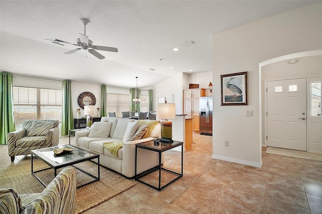 1093 Peninsula St, The Villages, FL 32162 - living area featuring a ceiling fan, baseboards, arched walkways, recessed lighting, and vaulted ceiling