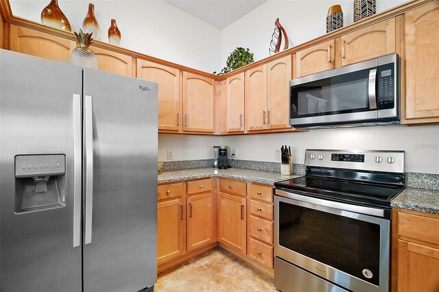 1093 Peninsula St, The Villages, FL 32162 - kitchen featuring appliances with stainless steel finishes and stone counters