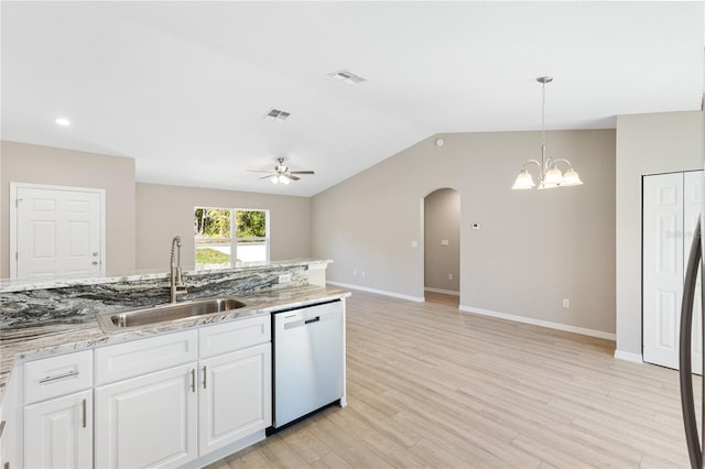 kitchen with visible vents, dishwasher, ceiling fan with notable chandelier, arched walkways, and a sink