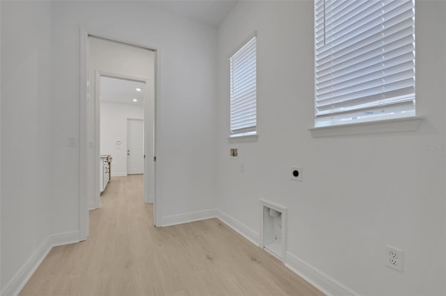 washroom featuring baseboards, light wood-type flooring, washer hookup, laundry area, and electric dryer hookup