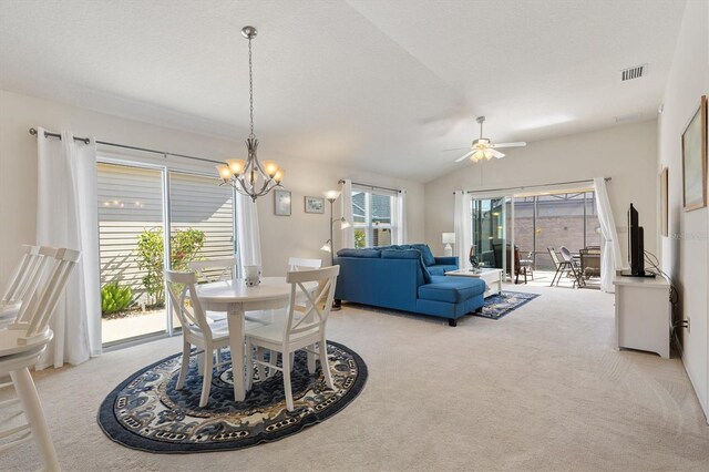 5829 Tupelo Ter, The Villages, FL 32163 - dining space featuring light carpet, a chandelier, lofted ceiling, and a ceiling fan