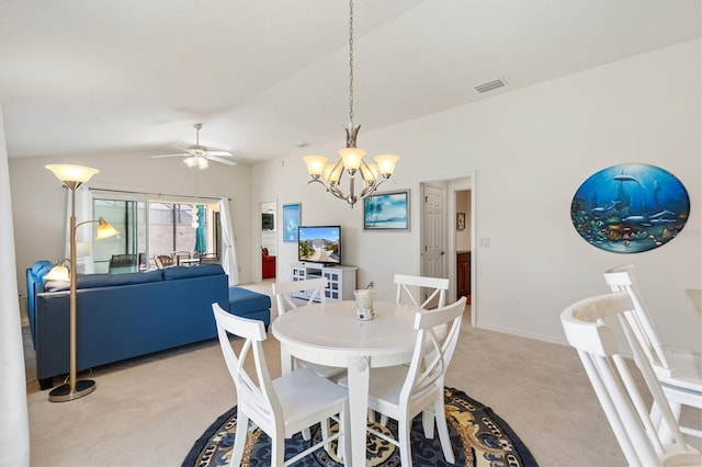 5829 Tupelo Ter, The Villages, FL 32163 - dining room featuring light carpet, a chandelier, vaulted ceiling, a ceiling fan, and baseboards