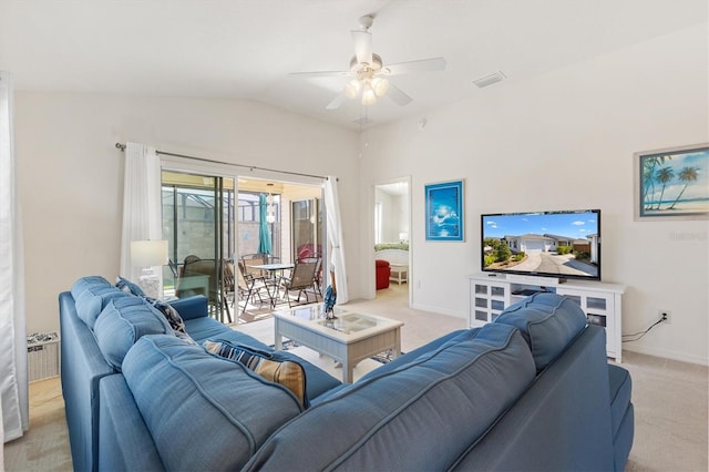 5829 Tupelo Ter, The Villages, FL 32163 - living area featuring a ceiling fan, light carpet, vaulted ceiling, and baseboards