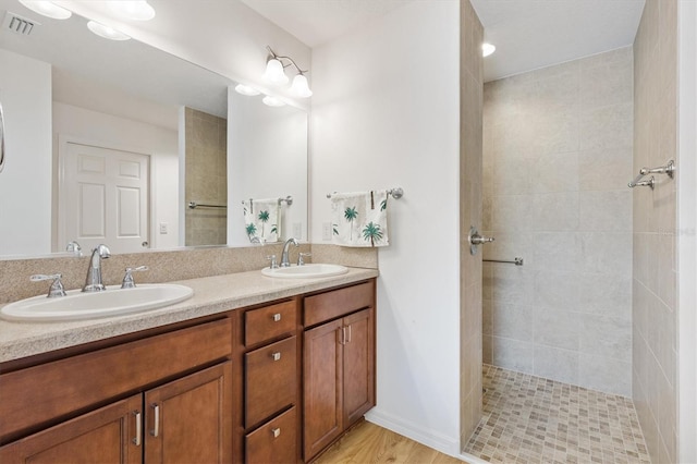 5829 Tupelo Ter, The Villages, FL 32163 - full bathroom with tiled shower and double vanity