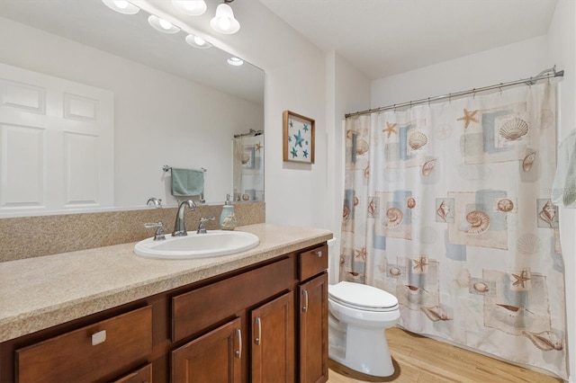 5829 Tupelo Ter, The Villages, FL 32163 - full bath featuring wood finished floors, toilet, vanity, and a shower with shower curtain