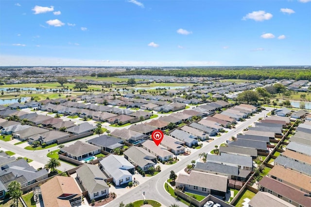 5829 Tupelo Ter, The Villages, FL 32163 - aerial view of property's location featuring a nearby body of water and nearby suburban area