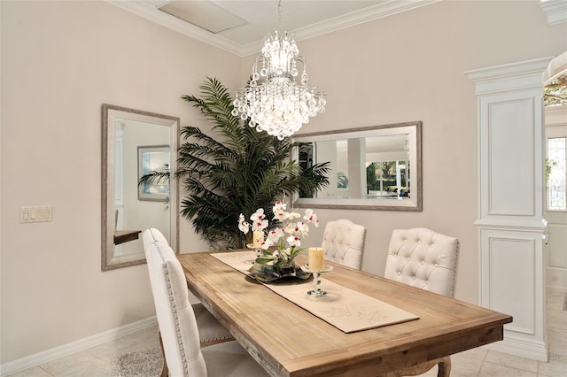 dining room featuring light tile patterned floors, a notable chandelier, baseboards, and ornamental molding