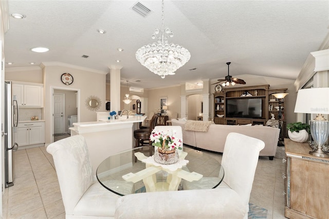 dining room with ornate columns, light tile patterned flooring, and lofted ceiling