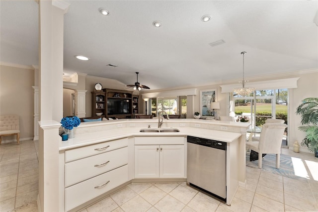 kitchen with a sink, ornamental molding, open floor plan, decorative columns, and stainless steel dishwasher