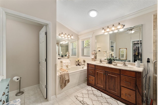 bathroom featuring double vanity, ornamental molding, a bath, ceiling fan, and a sink