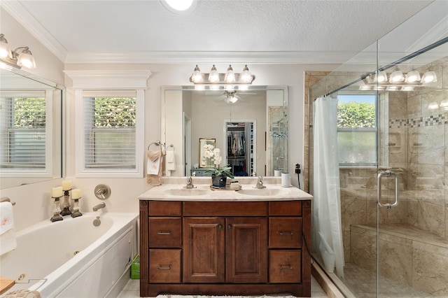 full bath featuring a sink, ornamental molding, a bath, and a shower stall