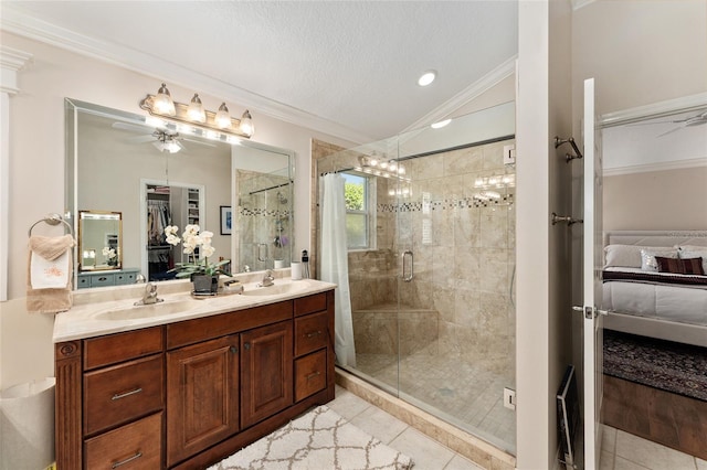 bathroom featuring ensuite bathroom, crown molding, a shower stall, tile patterned flooring, and lofted ceiling