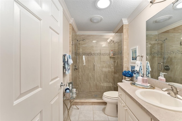 full bathroom with crown molding, vanity, toilet, a stall shower, and tile patterned floors