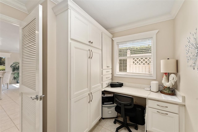 home office with built in desk, light tile patterned floors, and crown molding