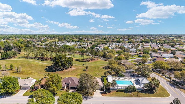 aerial view with golf course view and a residential view