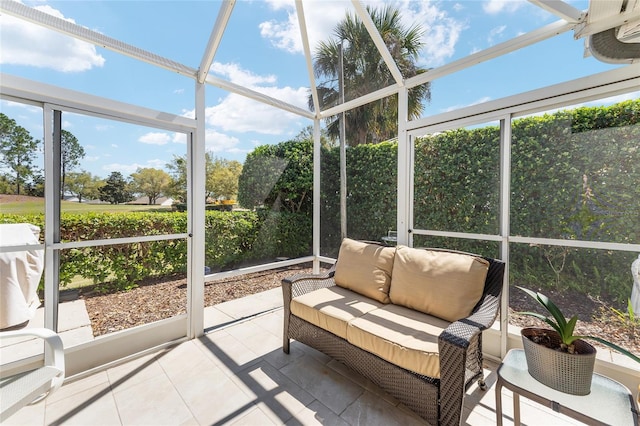 sunroom / solarium featuring an outdoor living space and plenty of natural light